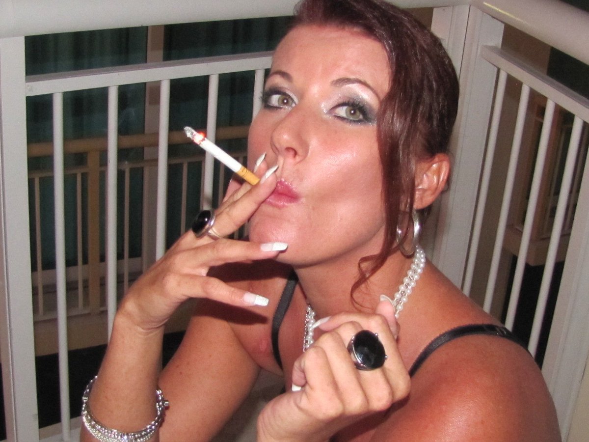Sexy wife smokes cigarette sucks dick