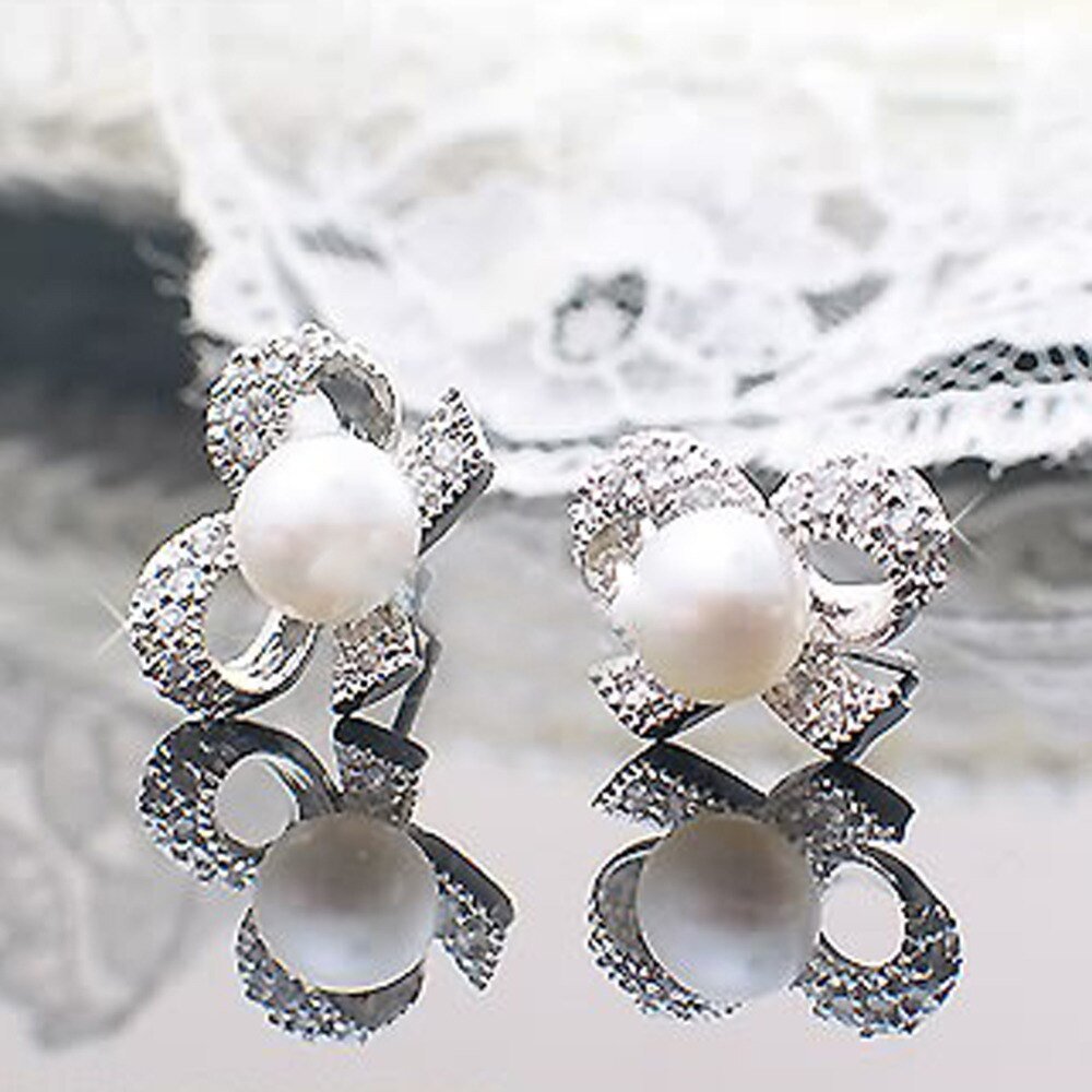 Серебряные серьги бантики с жемчугом